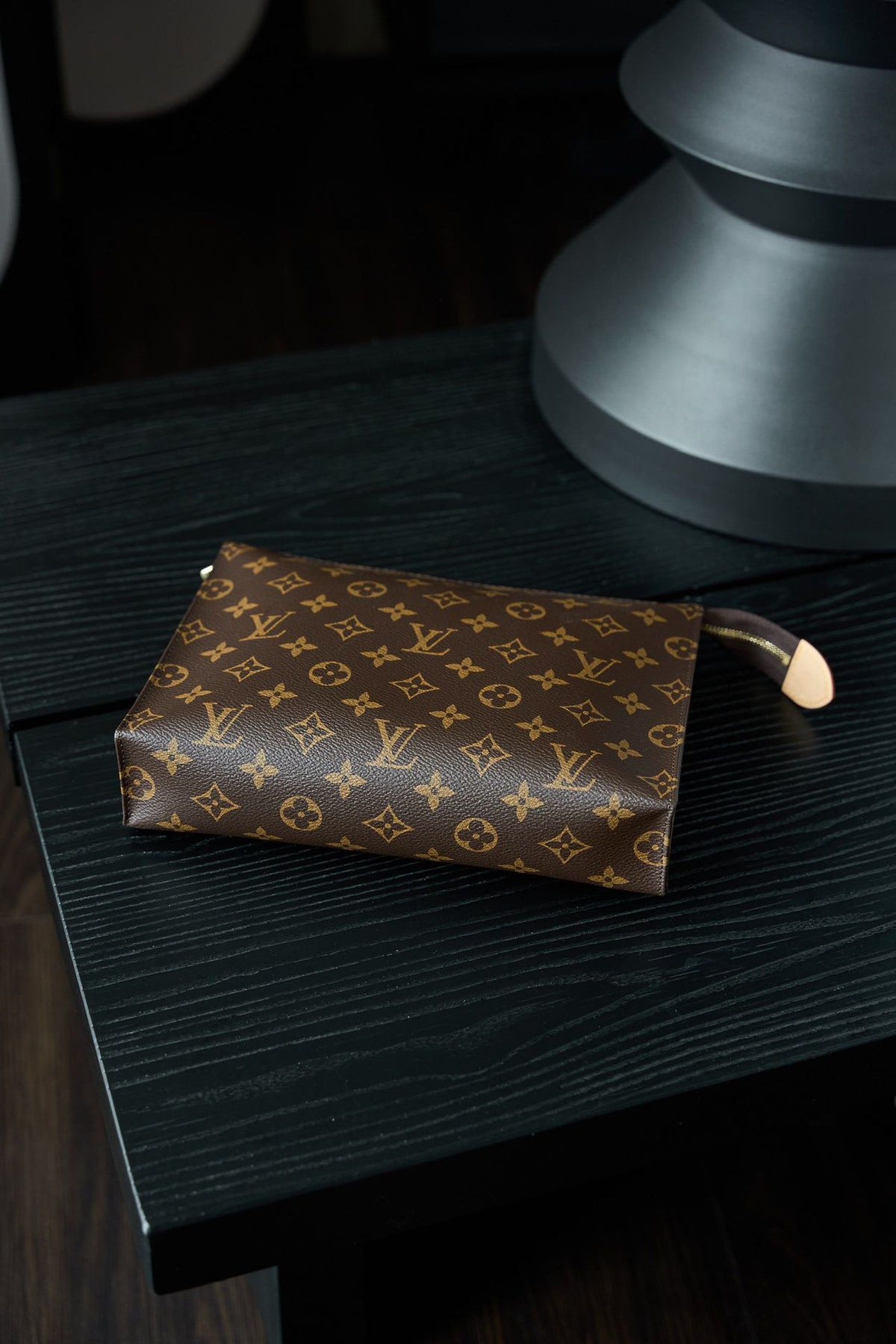 M47542 Toiletry Bag, made of original diamond pattern floral fabric, with fully steel vacuum plated hardware, priced at 980
