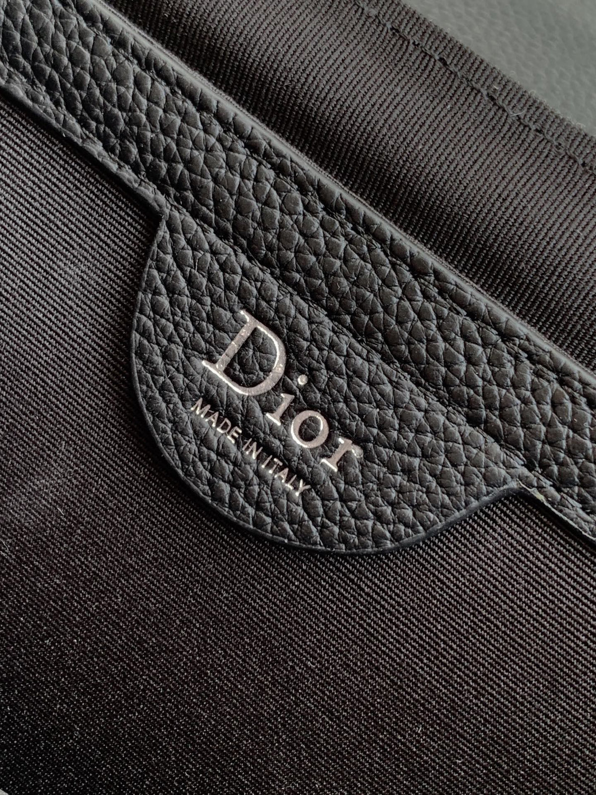 The Heritage Saddle Flap Messenger Bag is sophisticated and stylish with a distinctive style. Combining Oblique printed fabric with grained calfskin, it has an elegant saddle flap and is embellished with a Heritage buckle. A hallmark of classic craftsmans