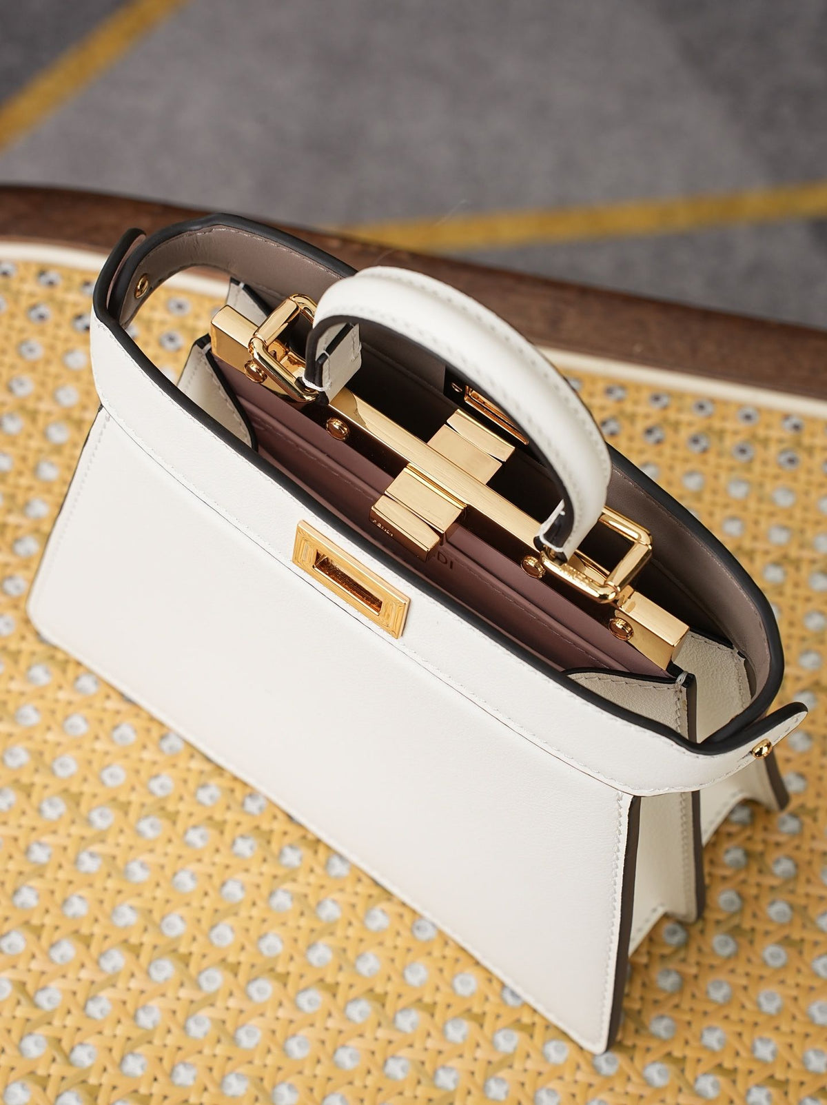 Model 8005, small size 20*11*15cm, FE ND1 "peekaboo I see u" handbag. Brand new "peekaboo I see u" is designed to showcase your unique side. The new style continues the classic trapezoidal silhouette and square twist lock design of the original "peekaboo"