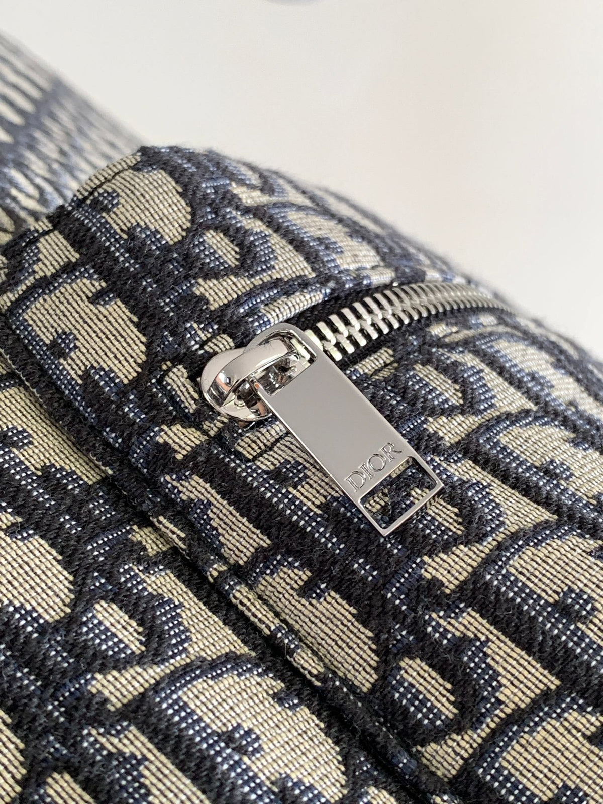 Large black text under the label Top quality original order This Rider backpack has a simple silhouette. The classic college style is full of vitality. Fashionable and modern. Carefully crafted from beige and black jacquard fabrics. Decorated with Oblique
