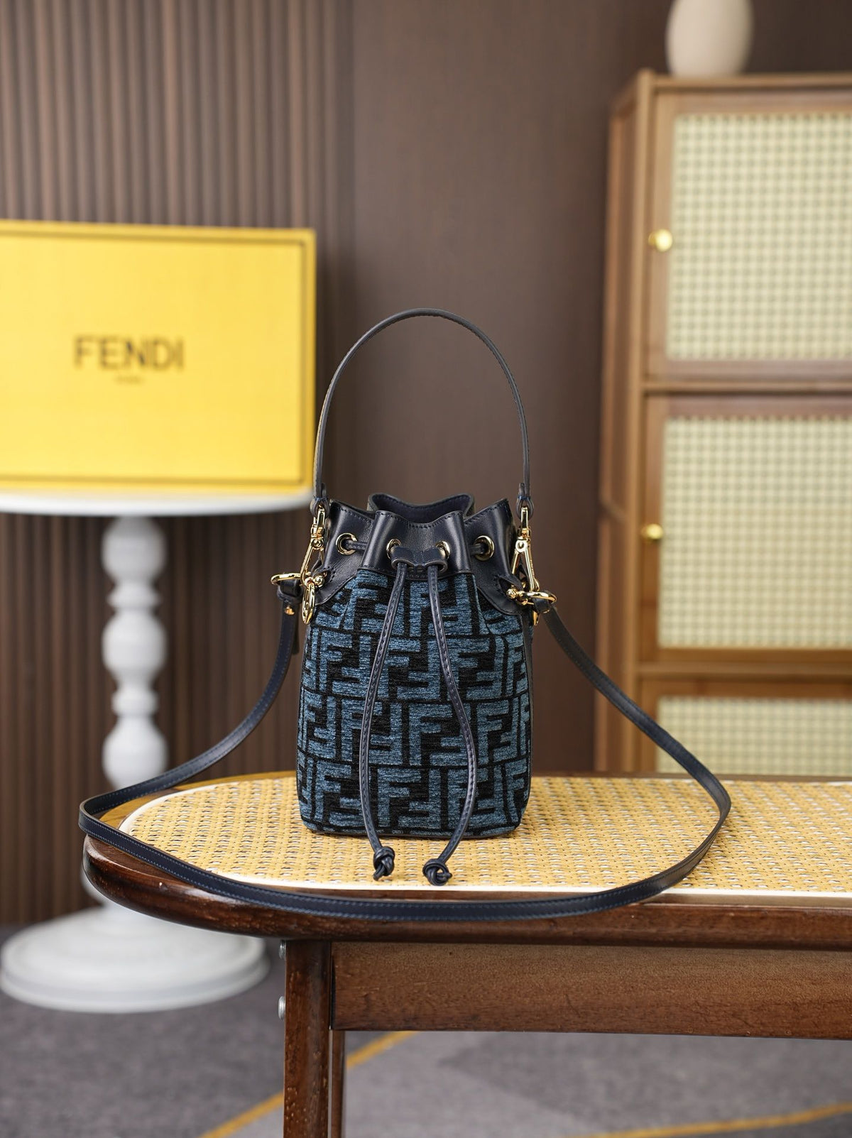 Model: 96827, Dark Blue, Size: 181210㎝. This FENDI-style MON TRÉSOR bucket bag features the iconic pigeon grey FF logo. It is highly practical for both shoulder or hand-carrying