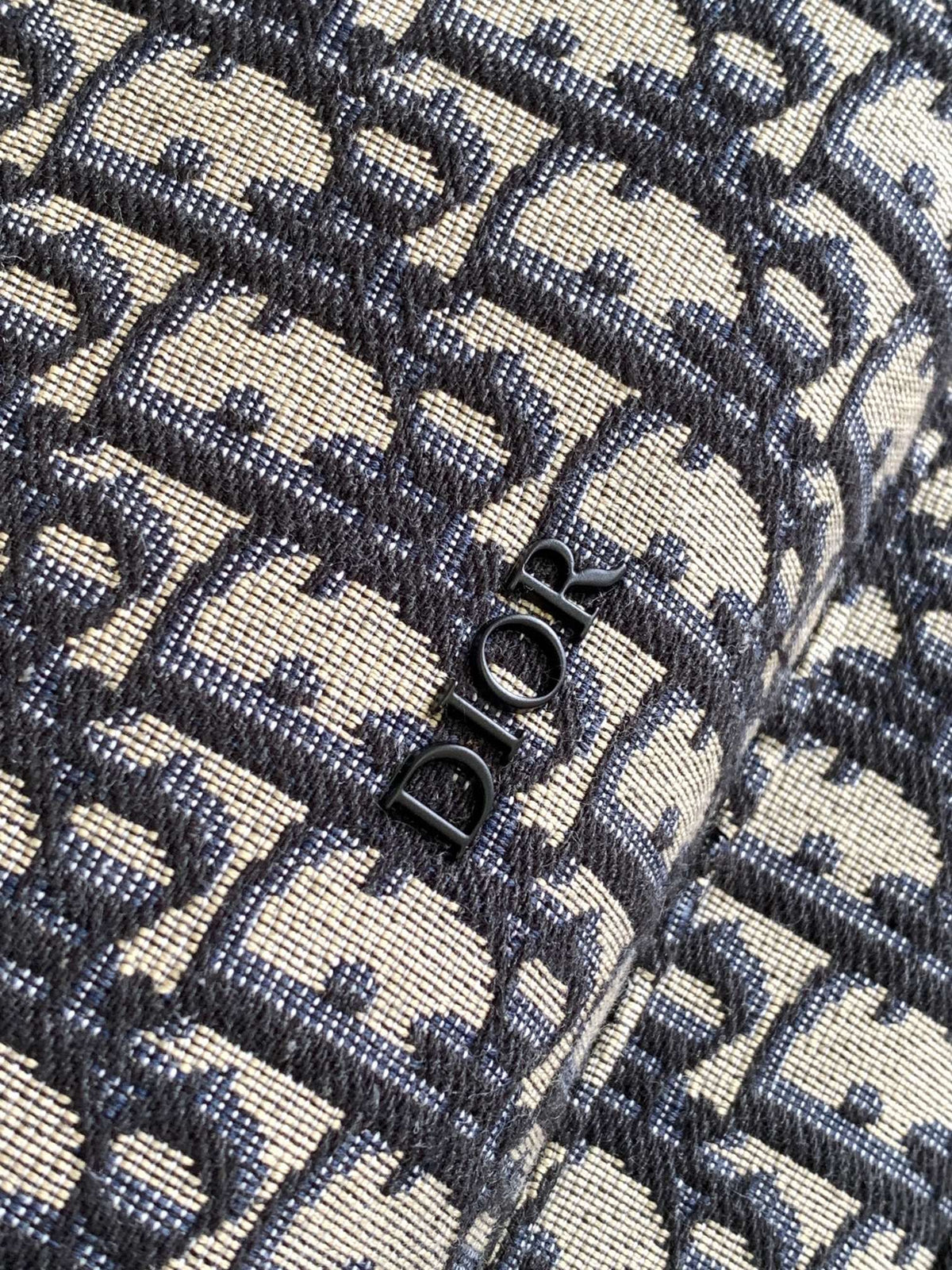 Large black text under the label Top quality original order This Rider backpack has a simple silhouette. The classic college style is full of vitality. Fashionable and modern. Carefully crafted from beige and black jacquard fabrics. Decorated with Oblique
