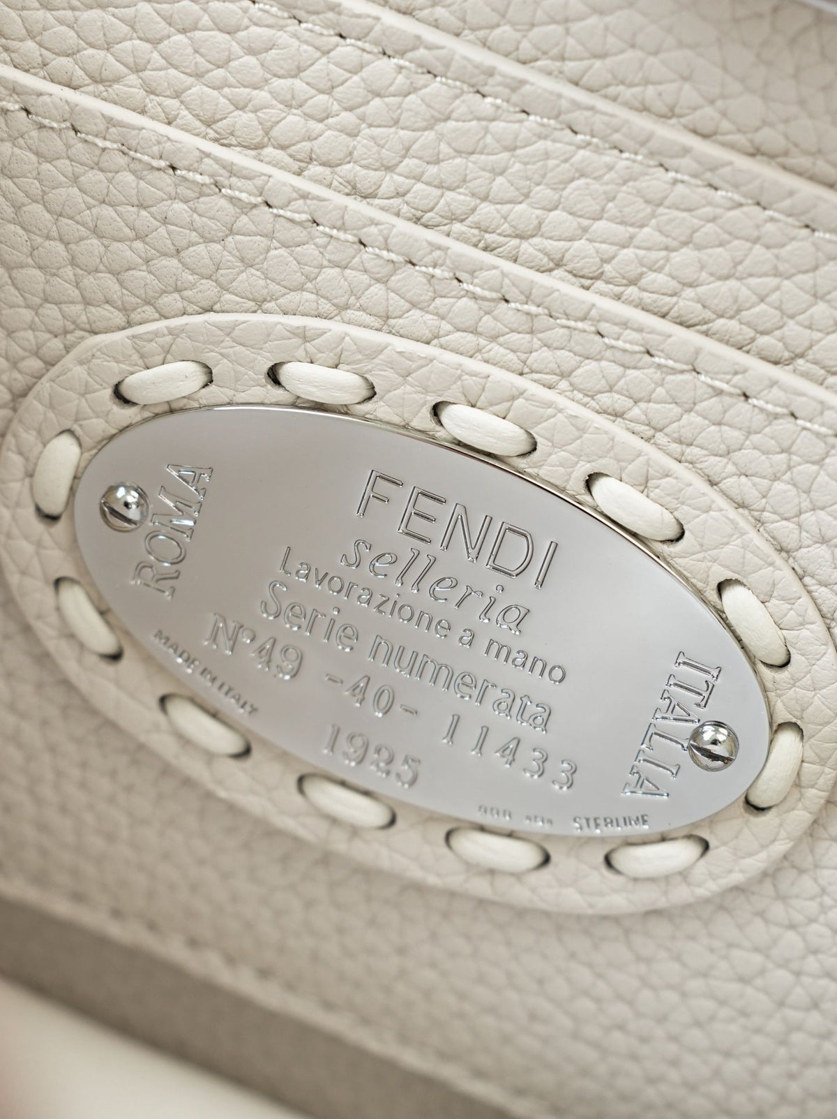 Model 15009, beige color, size 20cm. Details: beige hand-sewn, PeekabooISeeU medium-sized handbag, made of peel-effect calfskin leather, featuring classic twist locks on both sides, soft nappa leather lining, two compartments separated by a hard divider