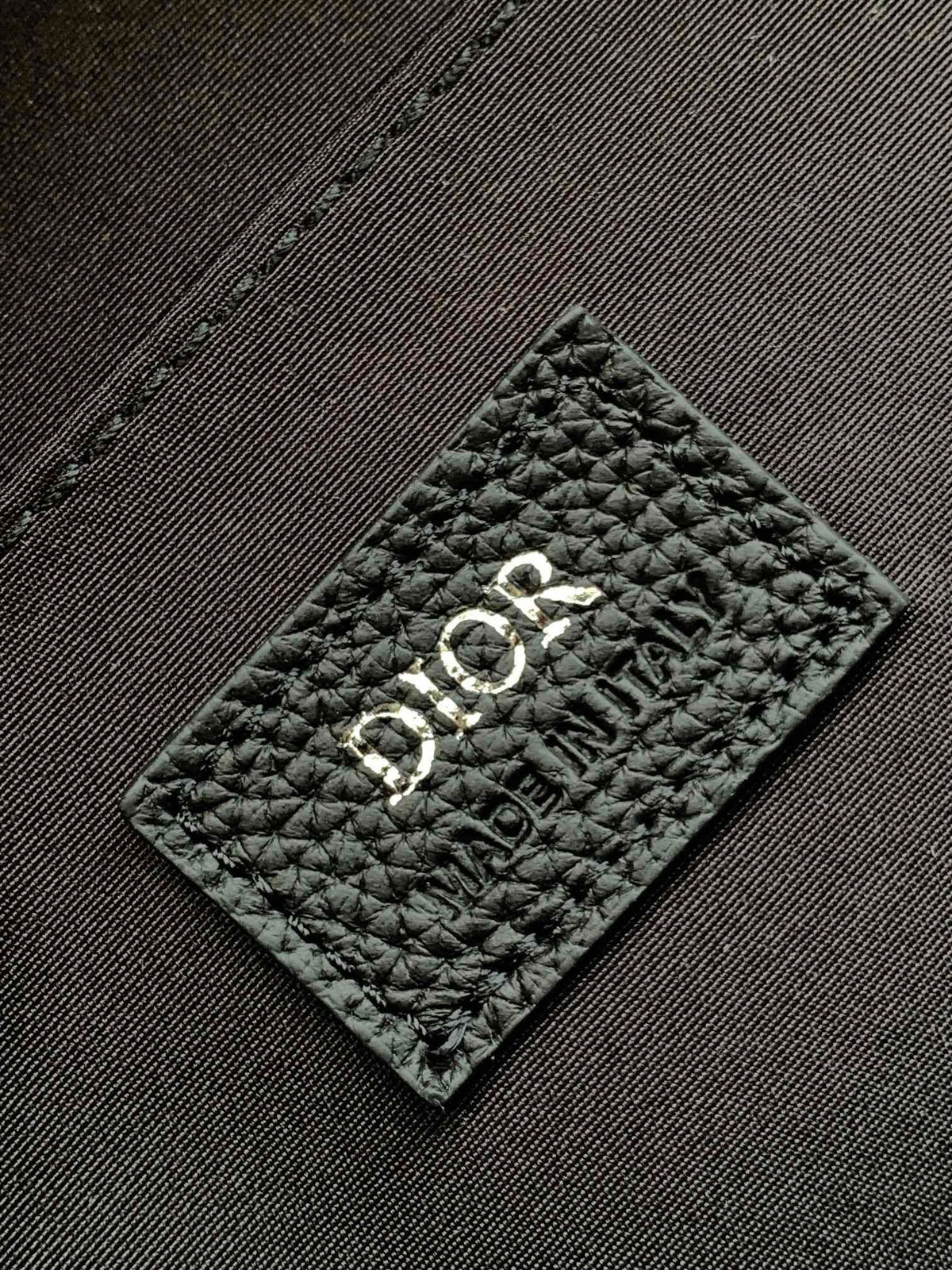 Large black text label. Top original order. This Rider backpack has a simple silhouette. The classic collegiate style is full of vitality. It is fashionable and modern. It is carefully made of beige and black jacquard fabrics and decorated with Oblique