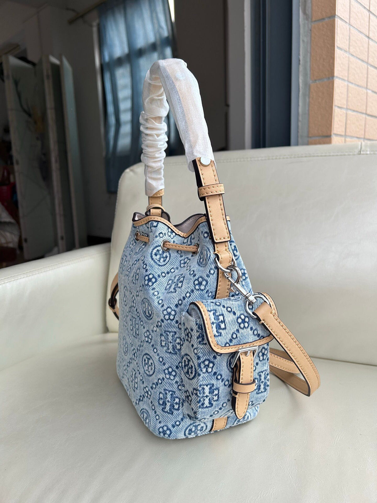 Tory Burch's classic T Monogram collection denim denim material paired with iconic patterns