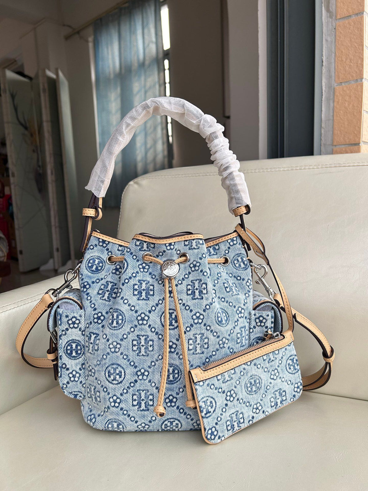 Tory Burch's classic T Monogram collection denim denim material paired with iconic patterns