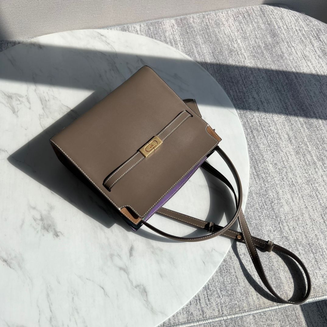 Purchasing quality 450.TB new Lee Radziwill bag with a stiff and contoured handbag shape, creating a modern and capable temperament, effortlessly showcasing fashion. Additional features include 1 middle zipper compartment, 1 zipper pocket, and a detachabl