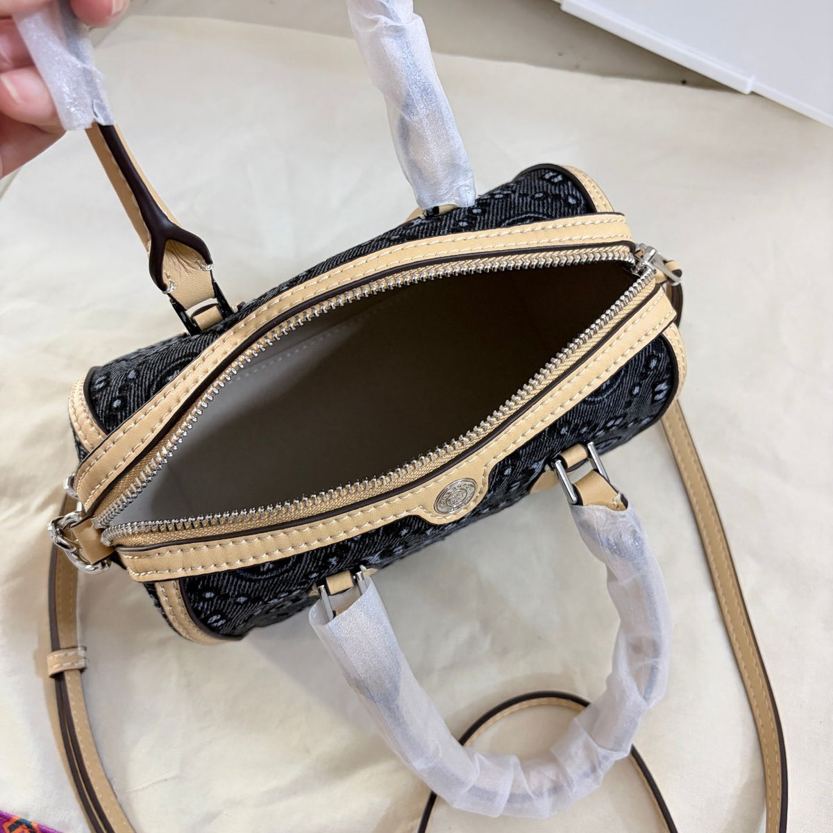 Tory Burch's T-Monogram collection of vintage Boston bags is often referred to as mini barrel bags or small handbags