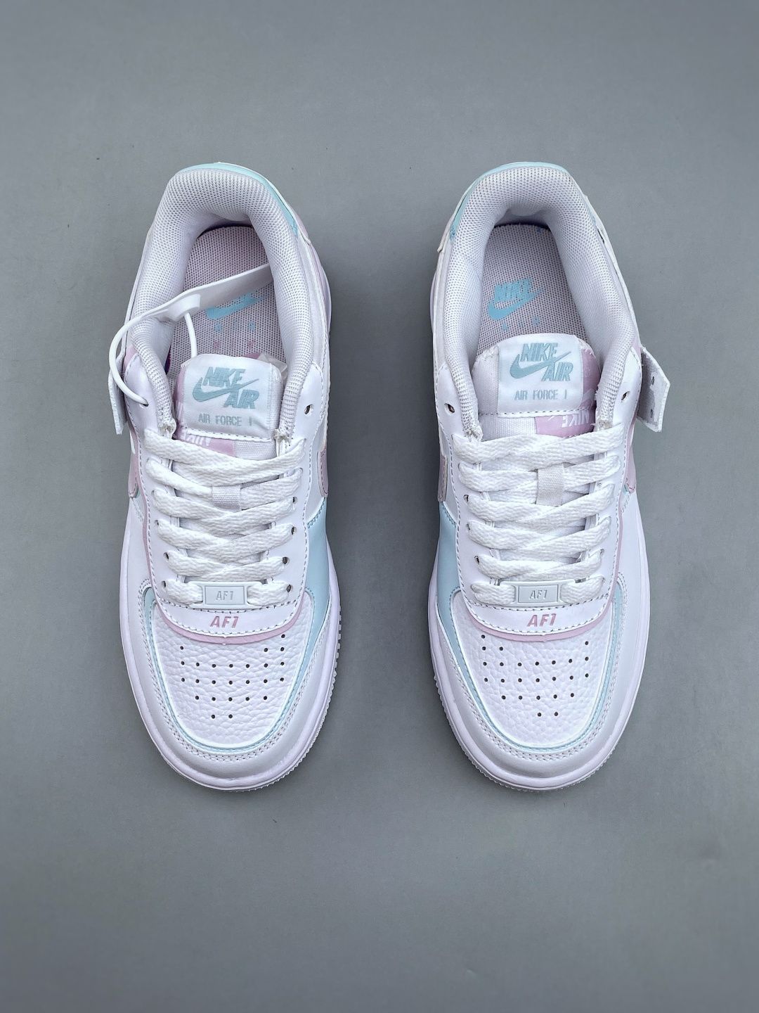 Support the launch of NIKE W AF1 SHADOW, a brand-new girly deconstructivist design. The Macaron Air Force 1 is a lightweight, height-increasing, low-top, versatile sneaker that injects playful elements into classic design. It features a layered structure