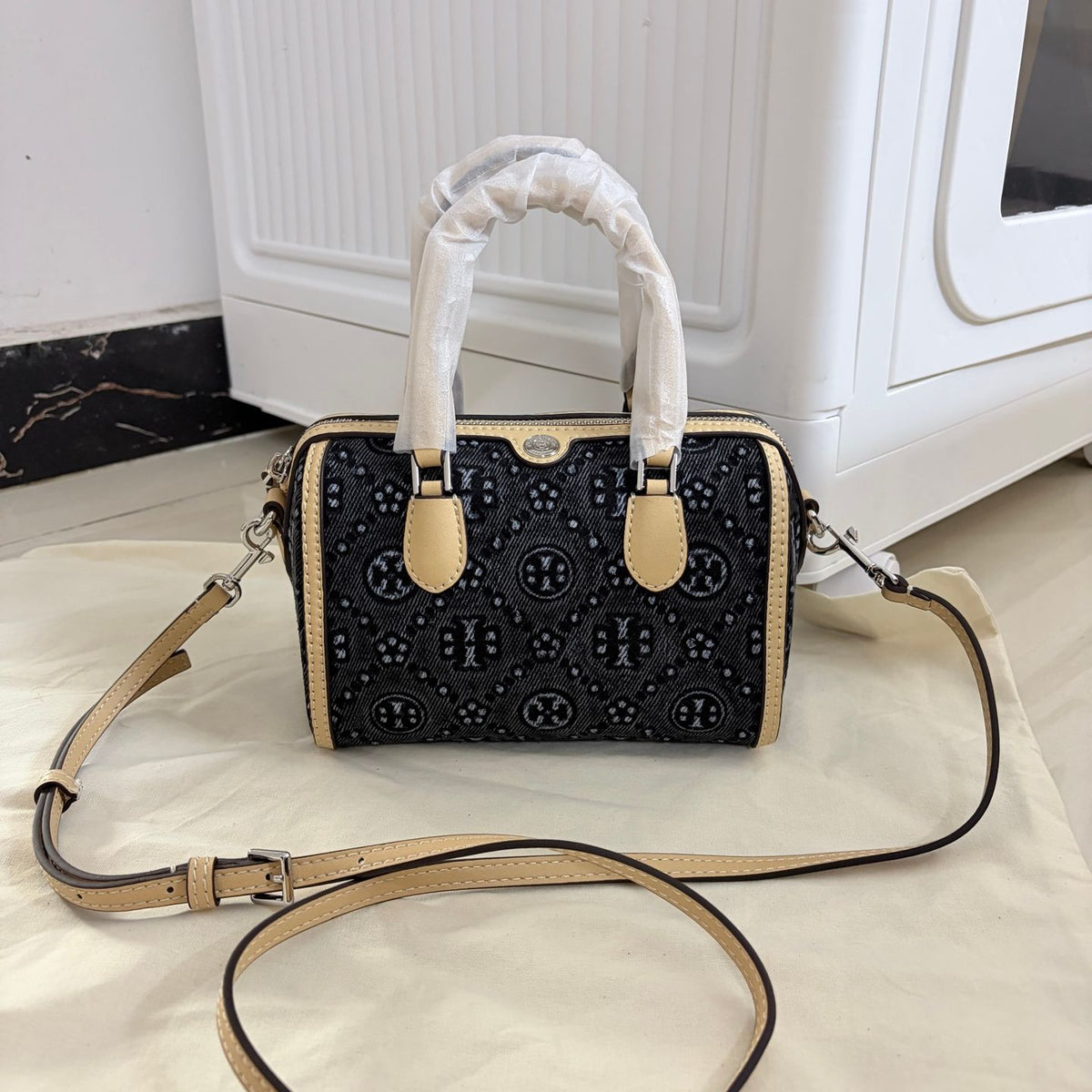 Tory Burch's T-Monogram collection of vintage Boston bags is often referred to as mini barrel bags or small handbags
