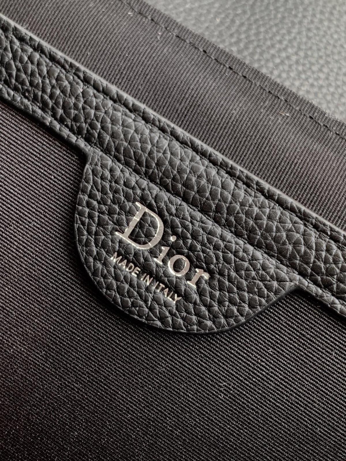 The Heritage Saddle Flap Messenger Bag is sophisticated and stylish with a distinctive style. Combining Oblique printed fabric with grained calfskin, it has an elegant saddle flap and is embellished with a Heritage buckle. A hallmark of classic craftsmans