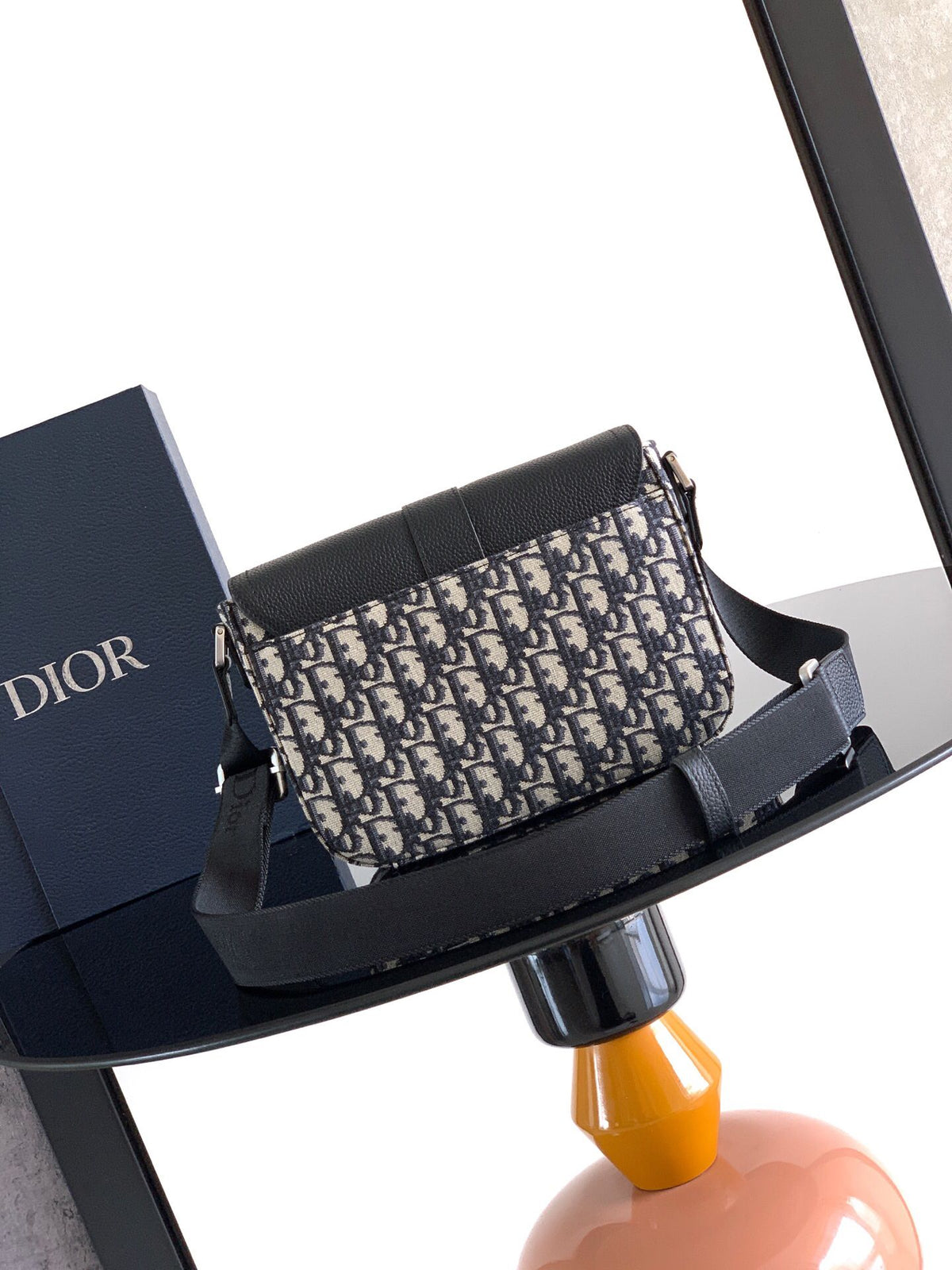 The Heritage Saddle Flap Messenger Bag is sophisticated and stylish with a distinctive style. Combining Oblique printed fabric with grained calfskin, it has an elegant saddle flap and is embellished with a Heritage buckle. A hallmark of classic craftsmans