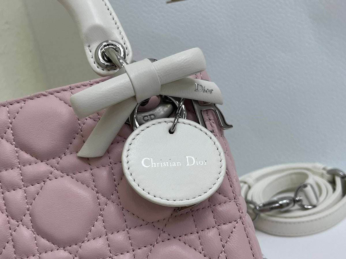 Bow Lady Dior Triple Check The classic Lady Dior bag epitomizes Dior's deep insight into elegance and beauty. Carefully crafted with cannage topstitching to create eye-catching quilting details. Elegant and timeless design. D.I.O.R. charm in silver-finish