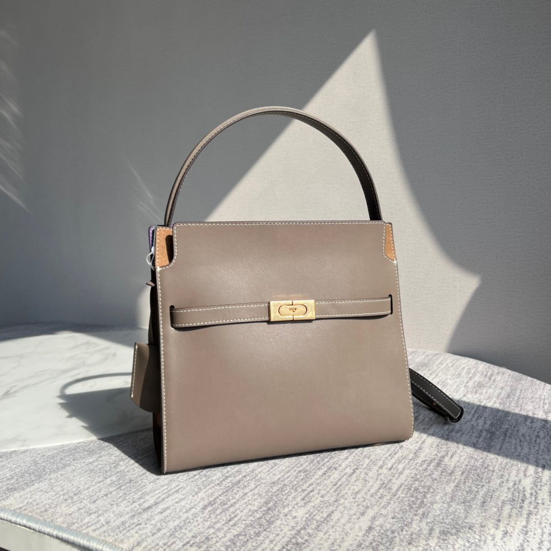 Purchasing quality 450.TB new Lee Radziwill bag with a stiff and contoured handbag shape, creating a modern and capable temperament, effortlessly showcasing fashion. Additional features include 1 middle zipper compartment, 1 zipper pocket, and a detachabl