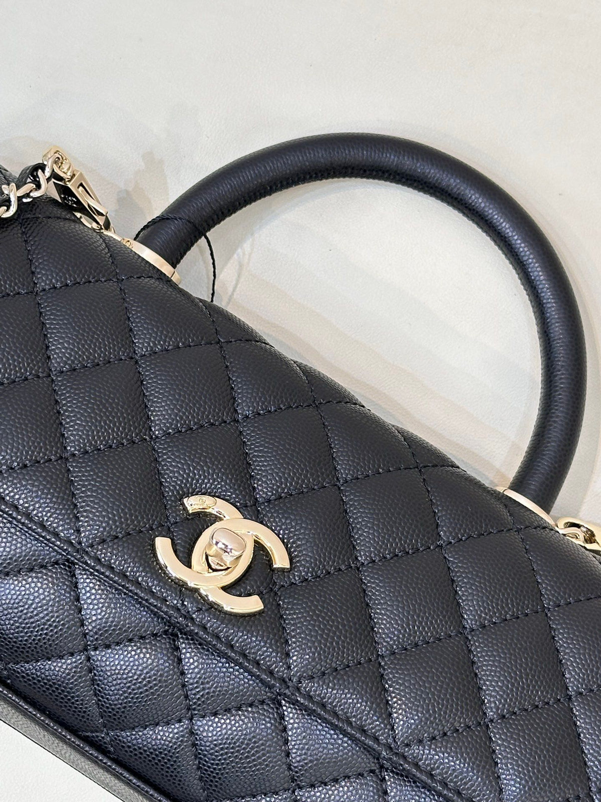 Black Quilted Top Handle Bag with Chain Strap