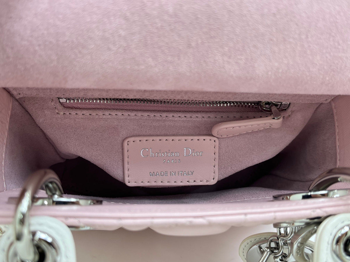 Bow Lady Dior Triple Check The classic Lady Dior bag epitomizes Dior's deep insight into elegance and beauty. Carefully crafted with cannage topstitching to create eye-catching quilting details. Elegant and timeless design. D.I.O.R. charm in silver-finish