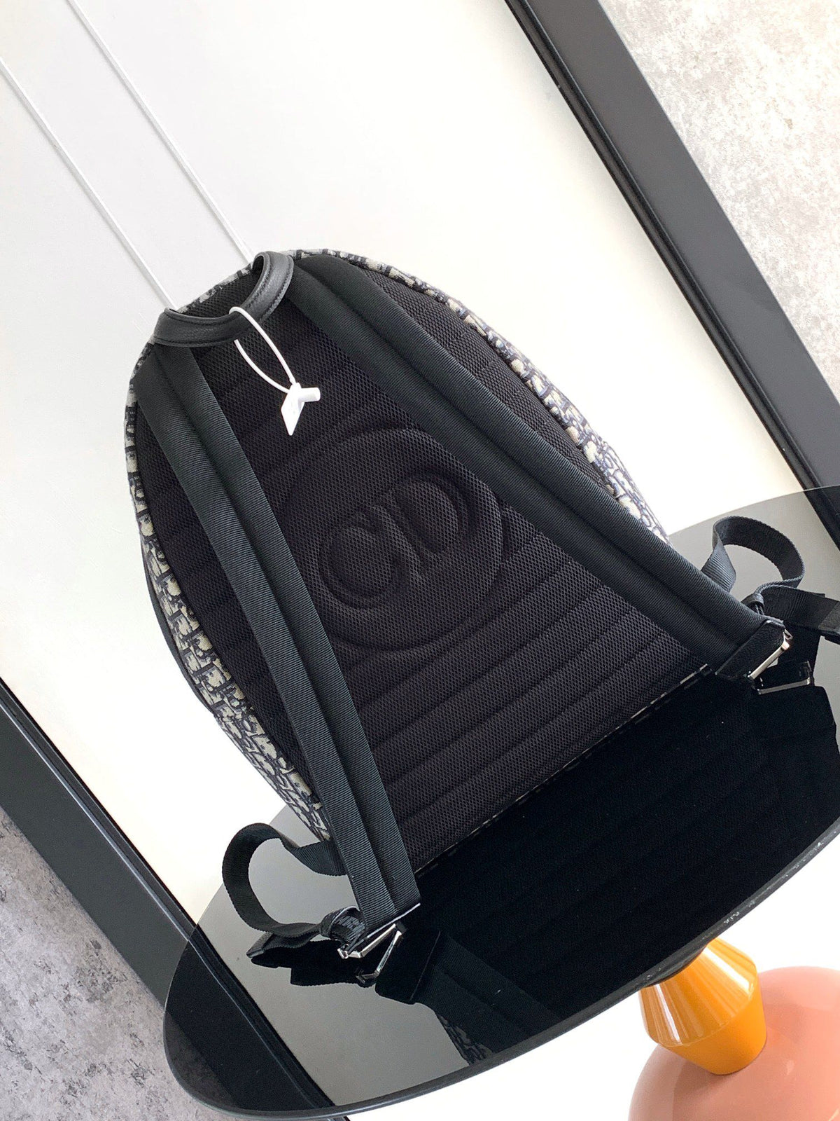 Large black text under the label Top quality original order This Rider backpack has a simple silhouette. The classic college style is full of vitality. Fashionable and modern. Carefully crafted from beige and black jacquard fabrics. Decorated with Oblique