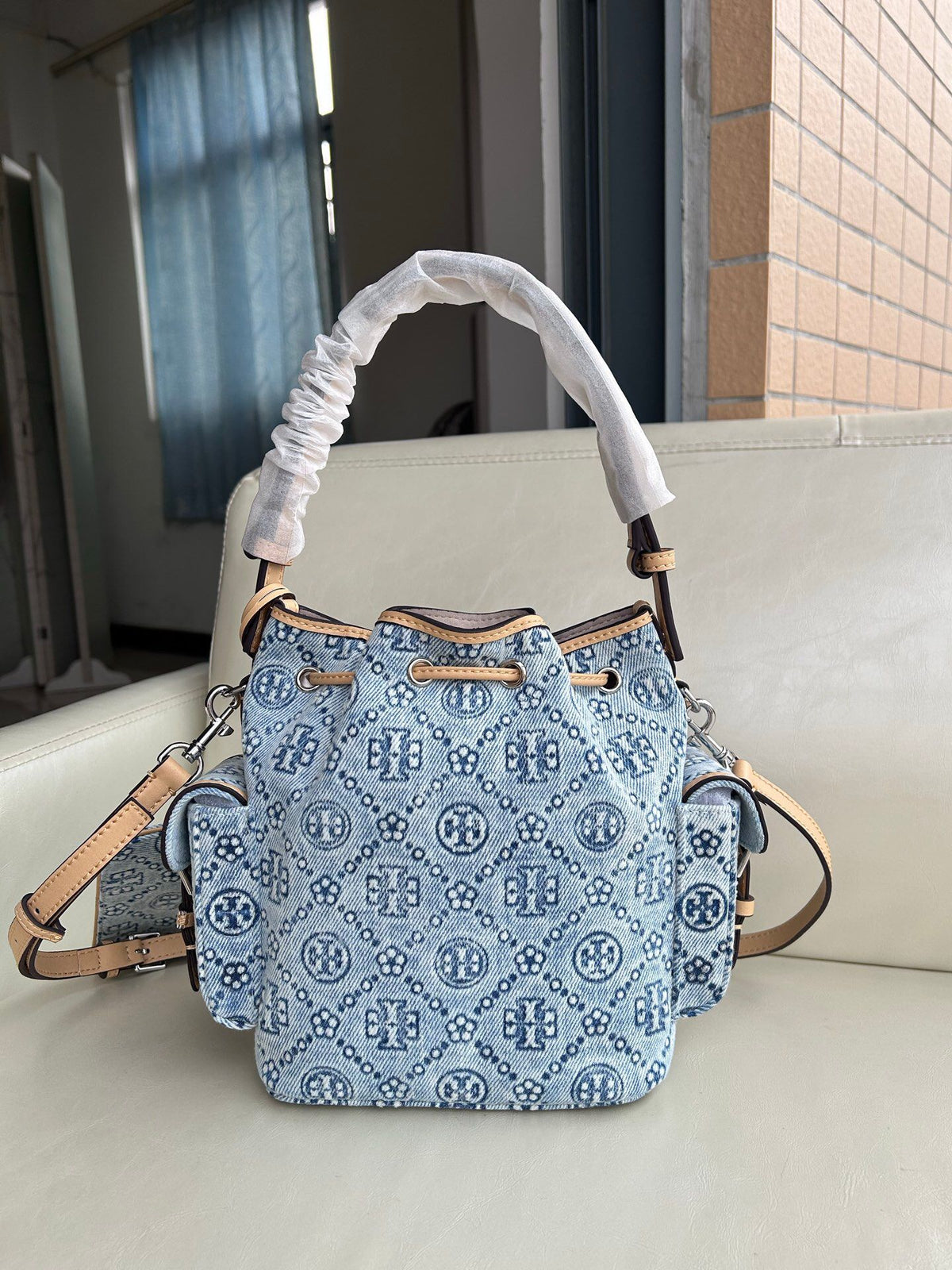 Tory Burch's classic T Monogram collection denim denim material paired with iconic patterns