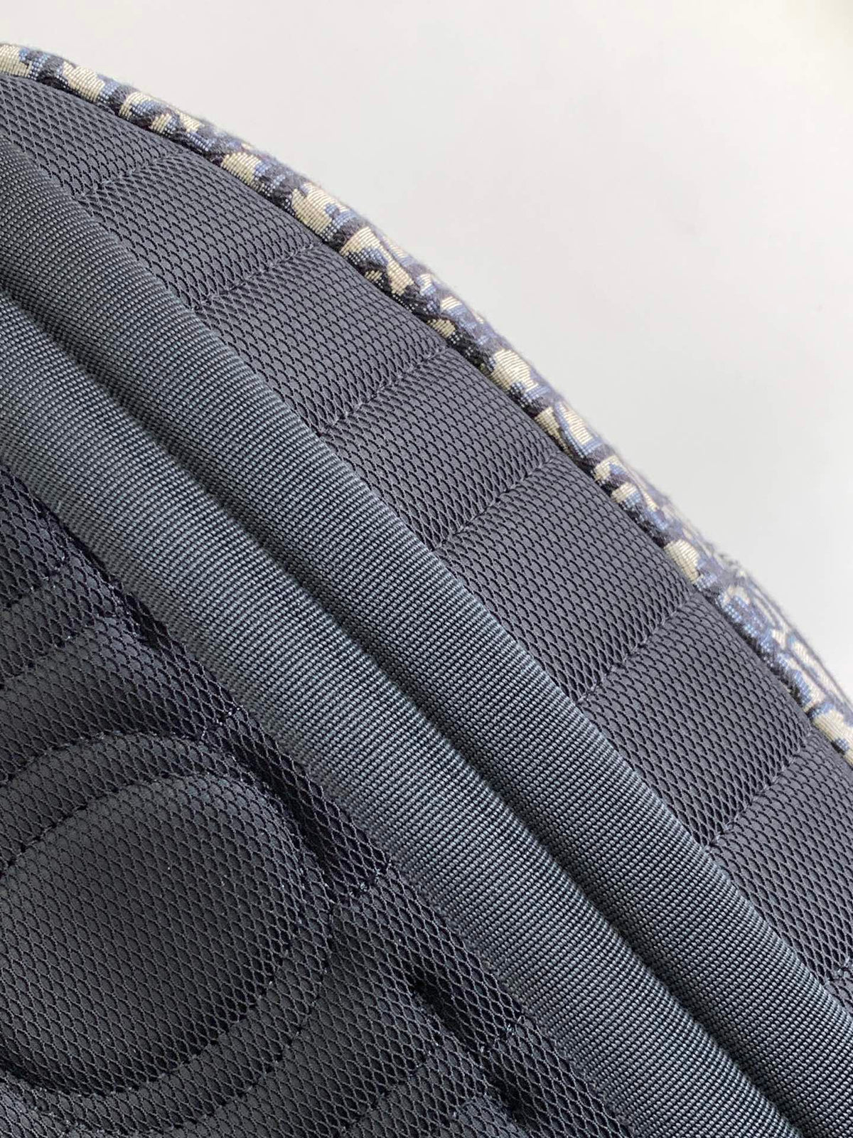Large black text label. Top original order. This Rider backpack has a simple silhouette. The classic collegiate style is full of vitality. It is fashionable and modern. It is carefully made of beige and black jacquard fabrics and decorated with Oblique