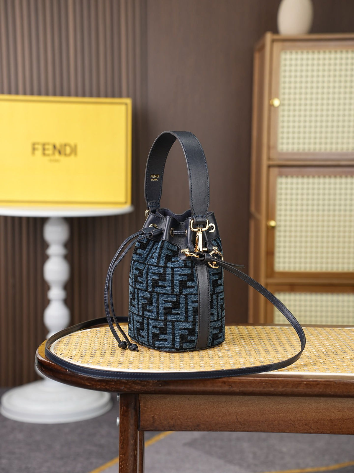 Model: 96827, Dark Blue, Size: 181210㎝. This FENDI-style MON TRÉSOR bucket bag features the iconic pigeon grey FF logo. It is highly practical for both shoulder or hand-carrying