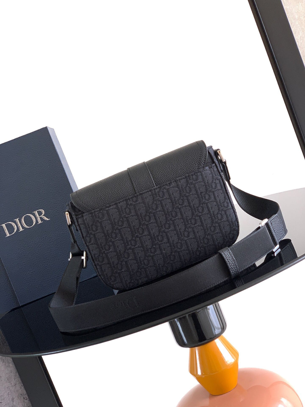 The Heritage Saddle Flap Messenger Bag is sophisticated and stylish with a distinctive style. Combining Oblique printed fabric with grained calfskin, it has an elegant saddle flap and is embellished with a Heritage buckle. A hallmark of classic craftsmans