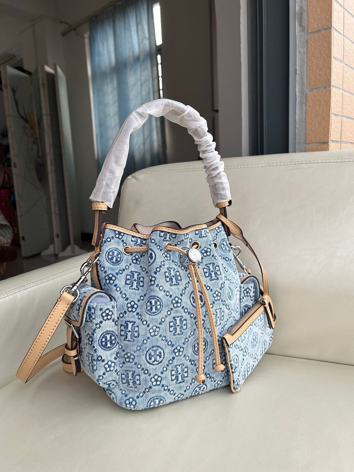 Tory Burch's classic T Monogram collection denim denim material paired with iconic patterns