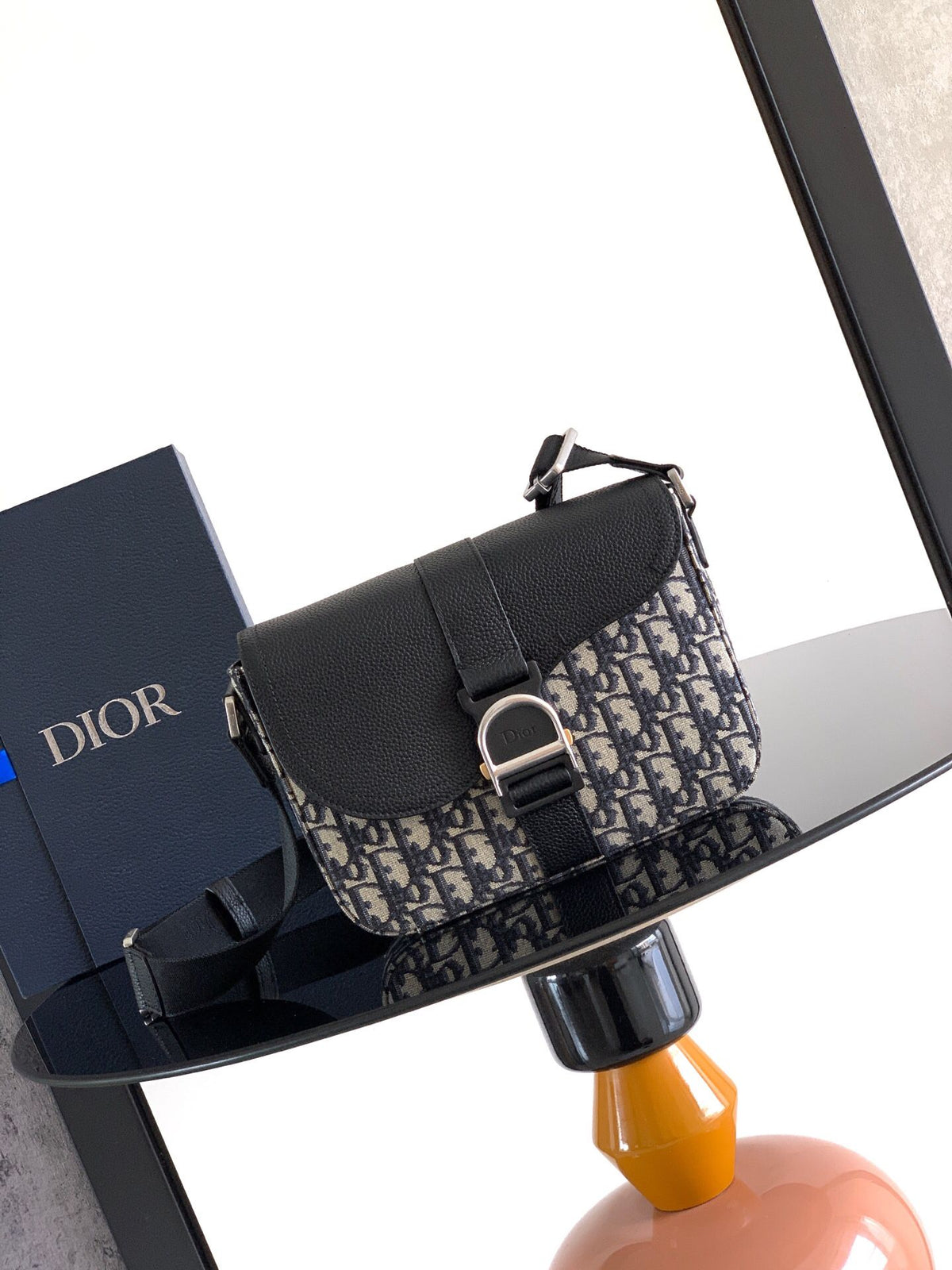 The Heritage Saddle Flap Messenger Bag is sophisticated and stylish with a distinctive style. Combining Oblique printed fabric with grained calfskin, it has an elegant saddle flap and is embellished with a Heritage buckle. A hallmark of classic craftsmans